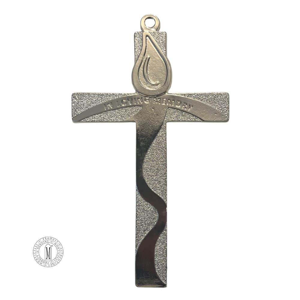 Silver memorial cross with engraved "In Loving Memory" inscription, flame emblem, and flowing wave design, made of metal with loop for hanging.