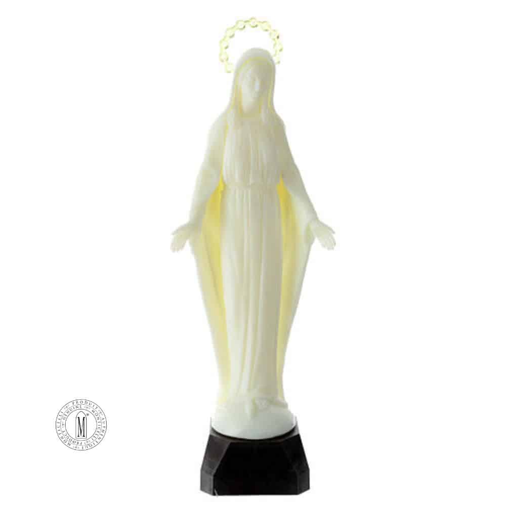 Glow-in-the-dark Virgin Mary plastic statue with halo on black base, standing with open arms in peaceful expression.