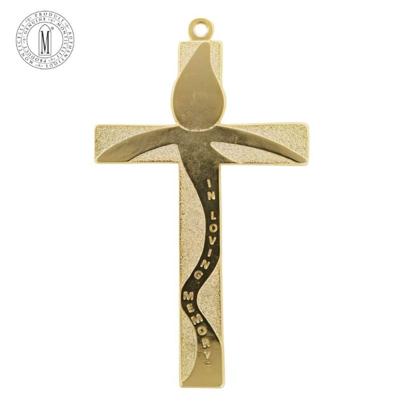 Back of gold-tone memorial wall cross with engraved flame and “In Loving Memory” message